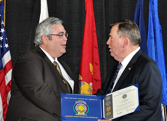 Our latest Commemorative Partners receive their flags and certificates during a ceremony at the New 