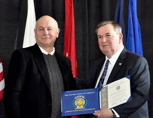 Our latest Commemorative Partners receive their flags and certificates during a ceremony at the New 