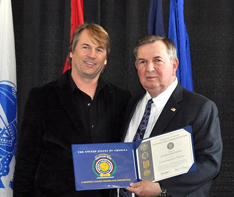 Our latest Commemorative Partners receive their flags and certificates during a ceremony at the New 