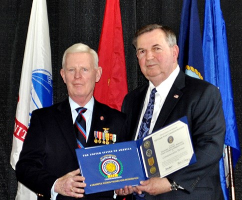 Our latest Commemorative Partners receive their flags and certificates during a ceremony at the New 