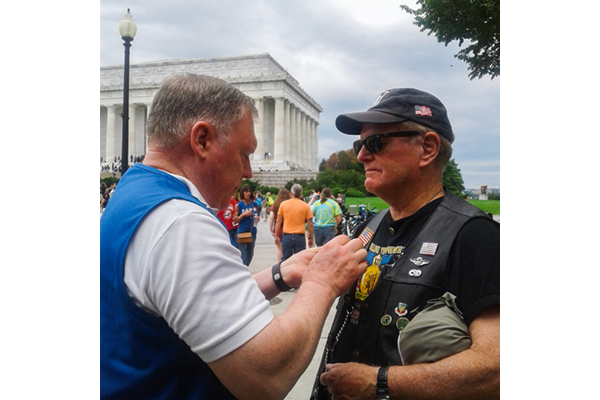 Barry Willey presents Vietnam Veteran Charles Rand Tupper the Vietnam Veteran Lapel Pin