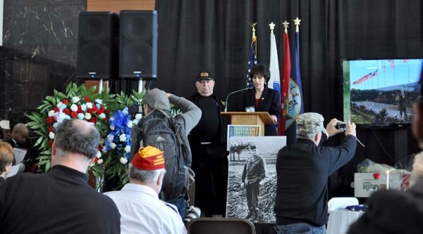 Volunteers read the names of the New York fallen servicemembers of the Vietnam War during a ceremony