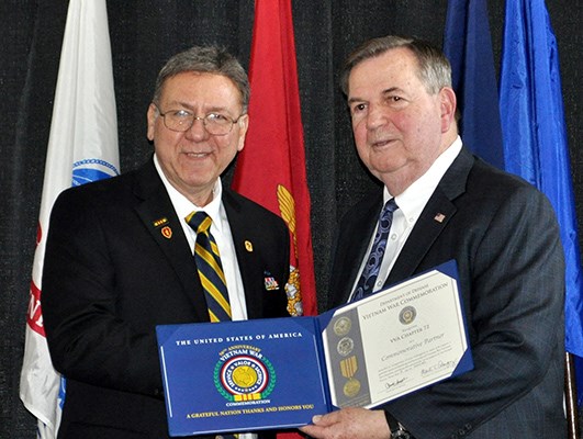 Our latest Commemorative Partners receive their flags and certificates during a ceremony at the New 