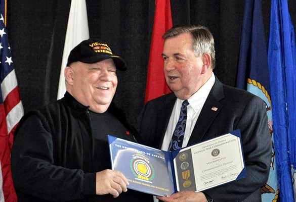 Our latest Commemorative Partners receive their flags and certificates during a ceremony at the New 