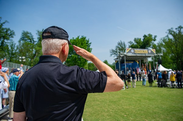 Attendee_salutes_during_the_Welcome_Home_Opening_Ceremony