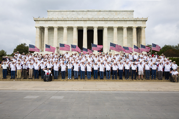 A group of Vietnam Veterans from one of four Nebraska Vietnam flights pose for a picture.