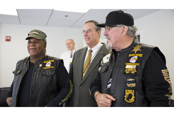 Air Force Master Sgt. Bubba Owens and retired Marine 1st Sgt. Walt Sides pose for a photo.