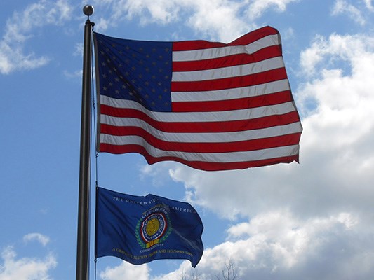 Vietnam War Commemoration flag flies at New York City Vietnam Veterans Memorial Plaza