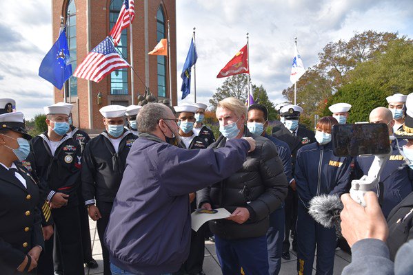 Master Chief Bruce Howard, a Vietnam veteran, is presented the Vietnam Veteran Lapel Pin at Eisenhow