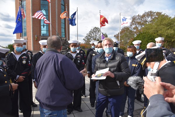 Master Chief Bruce Howard, a Vietnam veteran, is presented the Vietnam Veteran Lapel Pin at Eisenhow