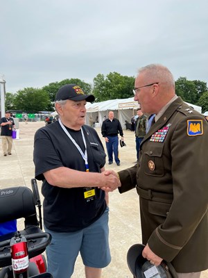 VWC Director, U.S. Army Maj. Gen. Edward J. Ch shakes hands with the Vietnam Veteran he just pinned.