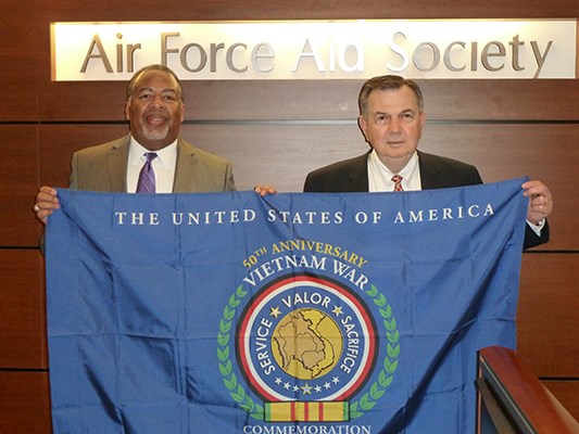 Air Force Aid Society is a commemorative partner.  Lt Gen &#40;Ret&#41; John Hopper accepts the flag from LT