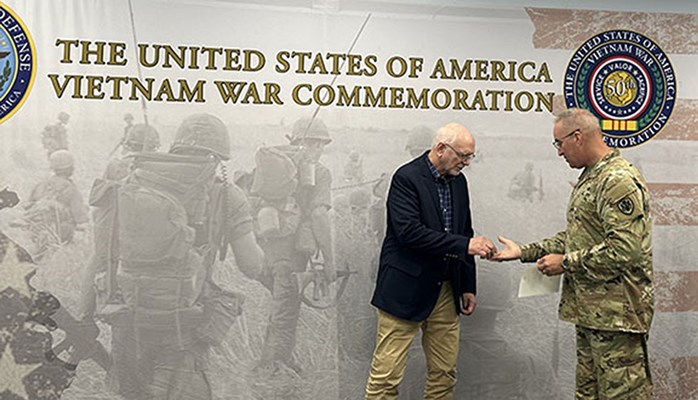 Vietnam veteran Neil Donahue was presented a coin by VWC Director Maj. Gen. Edward J. Chrystal, Jr.