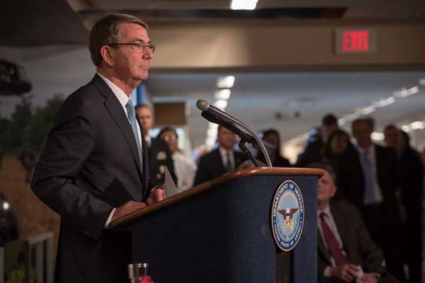 Secretary of Defense Ash Carter attends a Vietnam War hallway dedication ceremony.