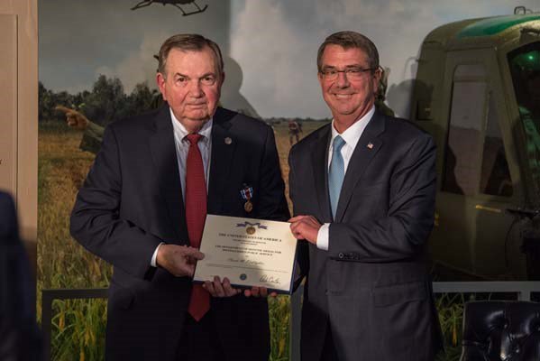 Secretary of Defense Ash Carter attends a Vietnam War hallway dedication ceremony.