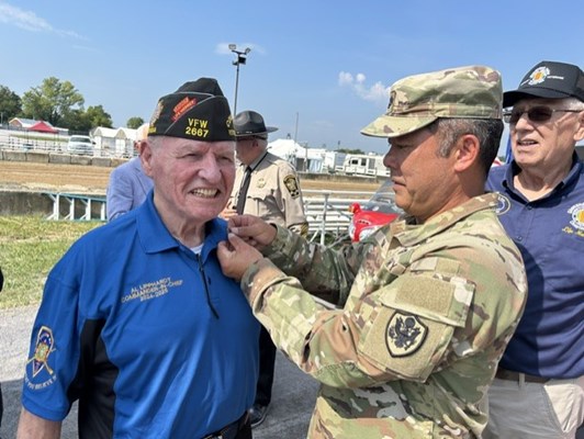 VFW National Commander Al Lipphardt is pinned by VWC&#39;s Col. Tom. 