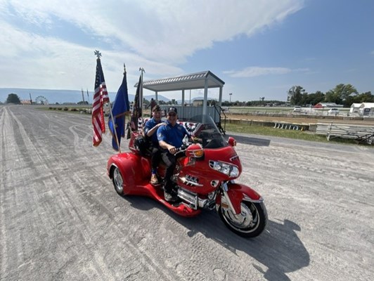 Two Vietnam Riders Group members participate in the Drive by event. 