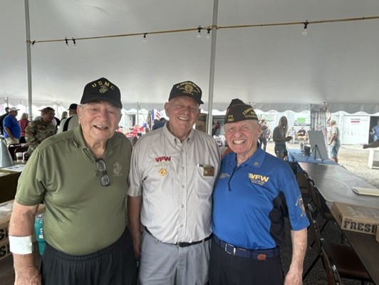 Two veterans pose with VFW Nat&#39;l. Commander Al Lipphard.