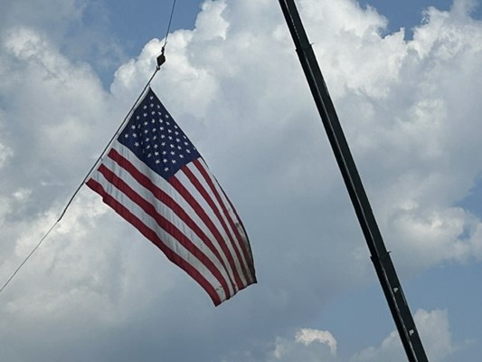 An American flag waves in the breeze.