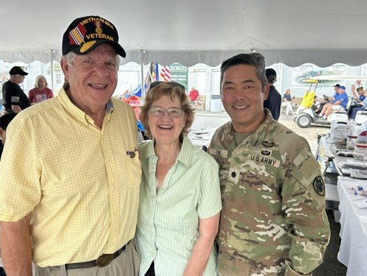 Col. Tom &#40;left&#41; poses for a photo with a Vietnam veteran and his wife.