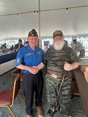 VFW National Commander Al Lipphardt poses for a photo with a Vietnam veteran.