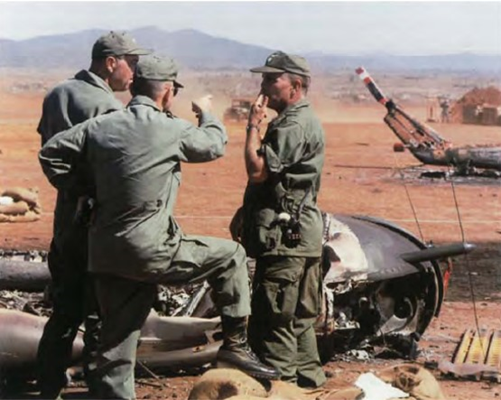 Army officers at Pleiku assess the damage from the sapper attack