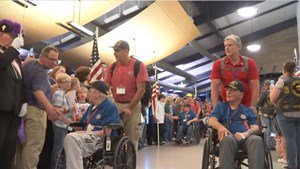 Crowds at Appleton International Airport welcome home veterans returning on the 50th Old Glory Honor Flight on May 29, 2019 