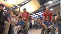 Crowds at Appleton International Airport welcome home veterans returning on the 50th Old Glory Honor Flight on May 29, 2019 