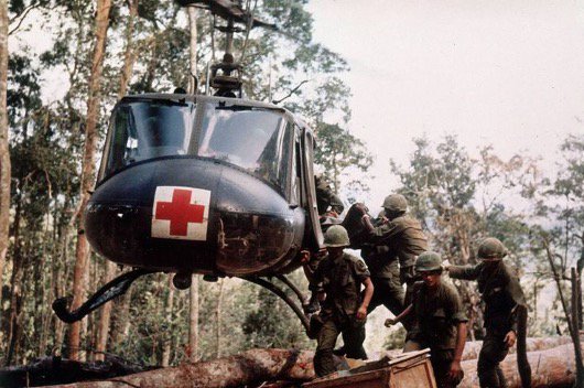 Photo of members of the 173d Airborne Brigade loading casualties aboard a UH-1 during the Battle of Dak To, November 22, 1967 (U.S Army)..
