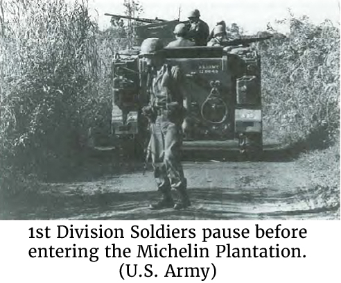 Photo of 1st Division Soldiers pausing before entering the Michelin Plantation. (U.S. Army)