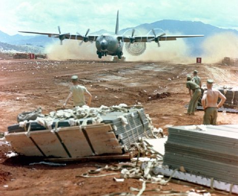 Photo of a C-130 delivering supplies to a Marine Corps base in South Vietnam, circa late 1960s.