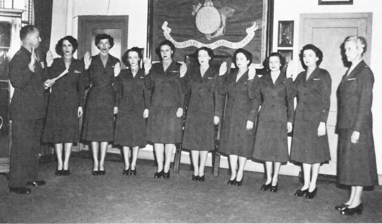 The Marine Corps Commandant administers the enlistment oath to the first eight women sworn into the regular Marine Corps, November 10, 1948.