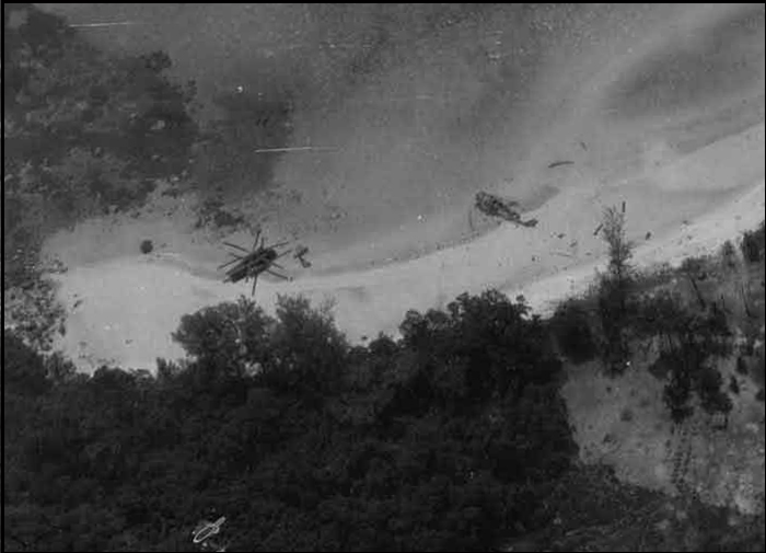 The wreckage of two U.S. helicopters on the beach of Koh Tang. (U.S. Air Force)