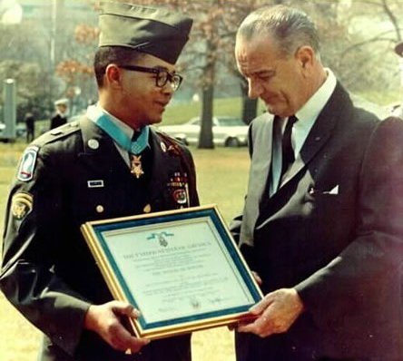 Joel receives a certificate for his Medal of Honor from President Lyndon Johnson, 1967. (U.S. Army)