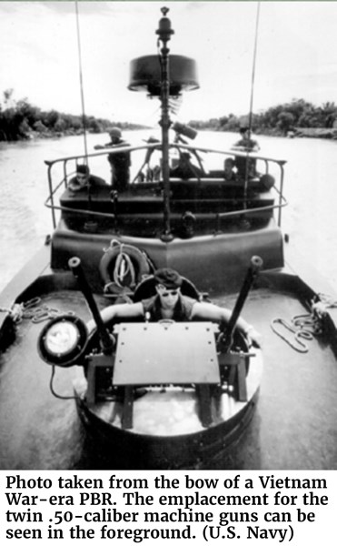 Photo taken from the bow of a Vietnam War-era PBR. The emplacement for the twin .50-caliber machine guns can be seen in the foreground. (U.S. Navy)