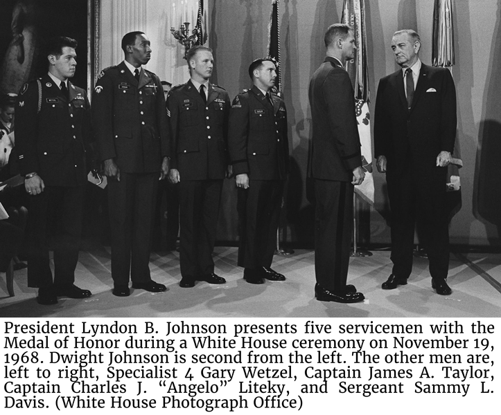 President Lyndon B. Johnson presents five servicemen with the Medal of Honor during a White House ceremony on November 19, 1968. Dwight Johnson is second from the left. The other men are, left to right, Specialist 4 Gary Wetzel, Captain James A. Taylor, Captain Charles J. “Angelo” Liteky, and Sergeant Sammy L. Davis. (White House Photograph Office)