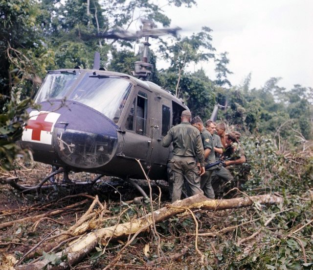 An American medevac UH-1 "Huey" takes aboard casualties, circa 1967.