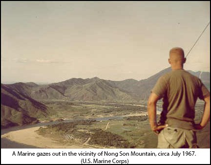 A Marine gazes out in the vicinity of Nong Son Mountain, circa July 1967. (U.S. Marine Corps)