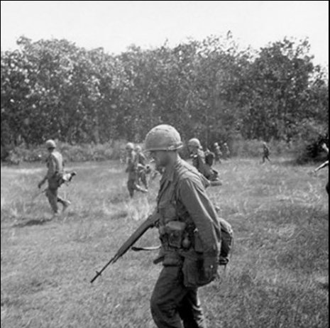 Photo of me of the U.S. 1st Infantry Division as they search for signs of Viet Cong activity during Operation CRIMP,