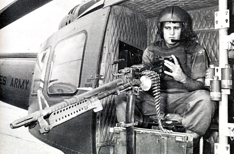 Able Seaman Adrian Whiteman mans a M60 machine gun as a “door-gunner.” The troop-carrying choppers were known as “slicks” as they lacked the mini-gun and rocket pod appendages of a helicopter gunship. (RAN photo)