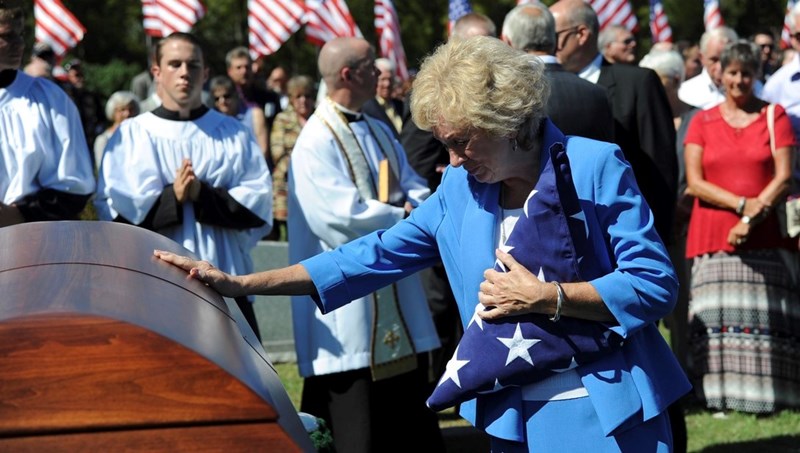 Dean Klenda’s sister Deanna says goodbye to her brother at his funeral, September 17, 2016, 51 years to the day after he was shot down over North Vietnam. (U.S. Air Force)