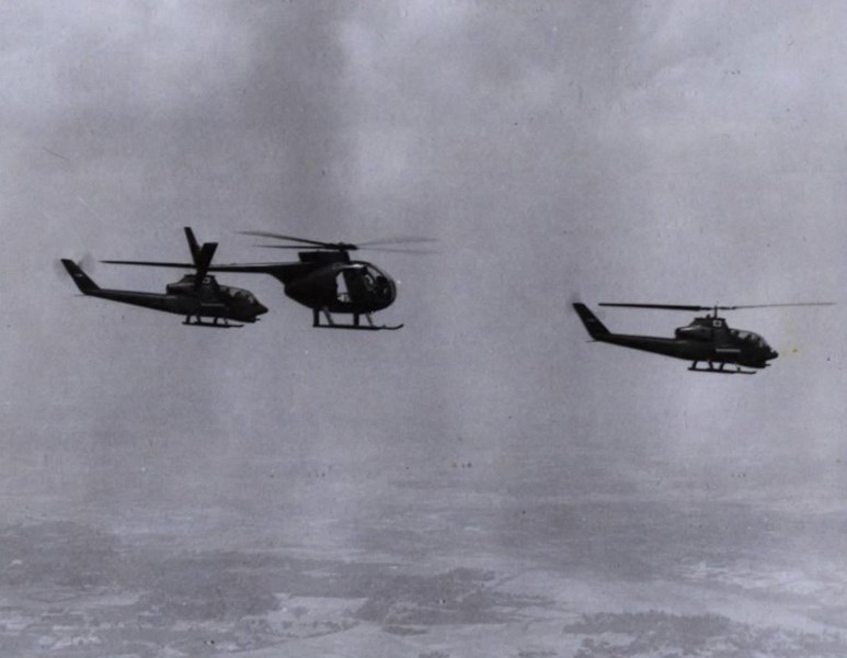 Two Cobras and a “Loach” helicopter on a mission near Phuoc Vinh, South Vietnam, 1969. (U.S. Army)